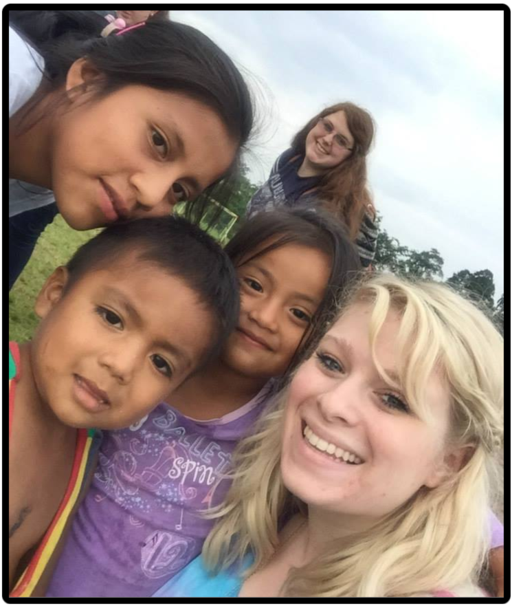 Skylar in Ecuador with some students
